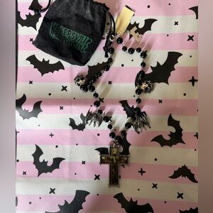 Elvira by Kreepville Black and Silver Cross Necklace with Skull and Wing Accents